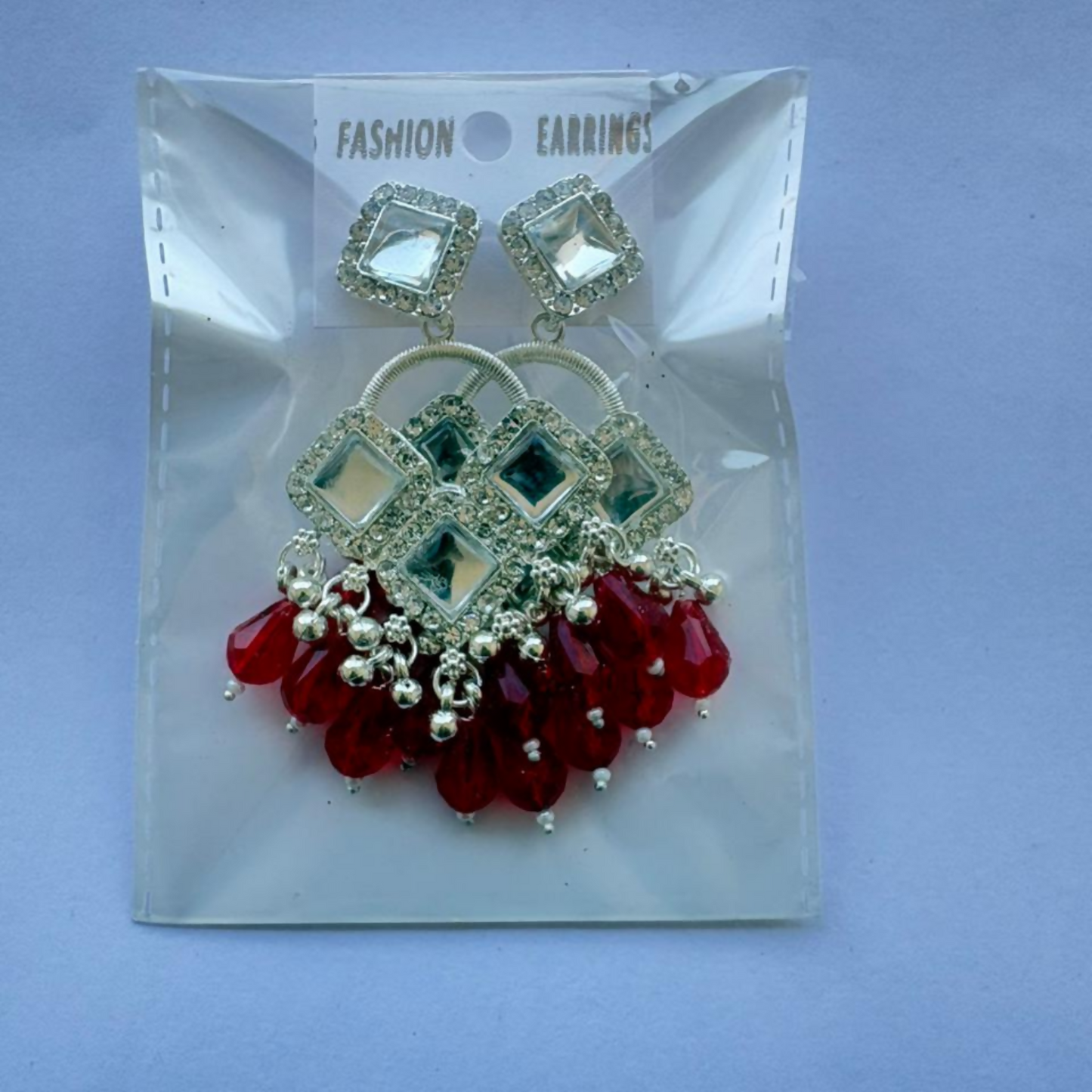 Pair of silver plated chandelier earrings with geometric crystals and vibrant red beads