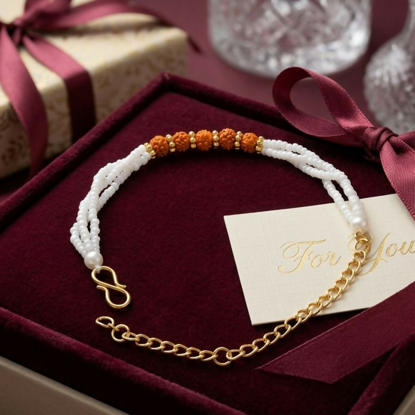 Adjustable gold-toned extension chain with secure S-hook clasp on bracelet