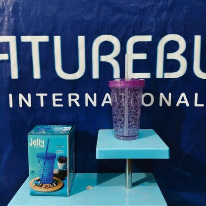 A purple plastic tumbler and a blue product box are displayed on a blue stand in front of a white logo.