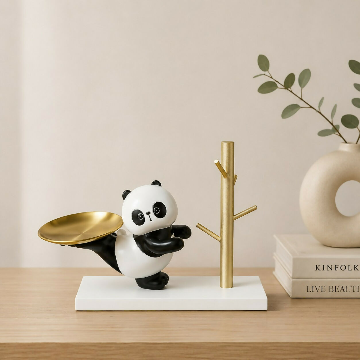 Elegant resin panda key holder tray suitable for home and office decor.