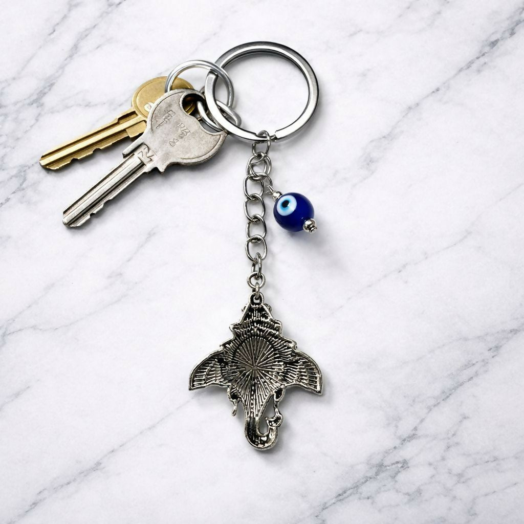 Silver finished Ganesh keychain on white background