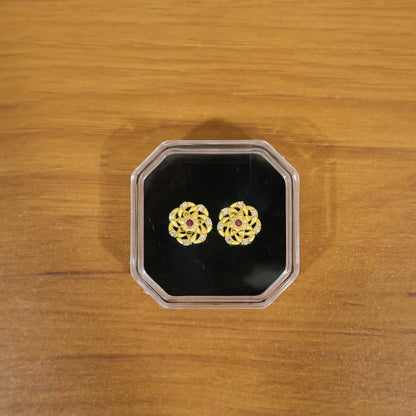 Stylish gold earrings with intricate design and sparkling stones for women