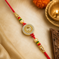 Auspicious Om (ॐ) Gold-Plated Designer Rakhi for Brother CZ Stone Studded Sacred Thread with Pearls