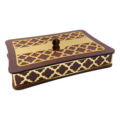 Close up image of decorative golden lid on wooden dry fruit storage box