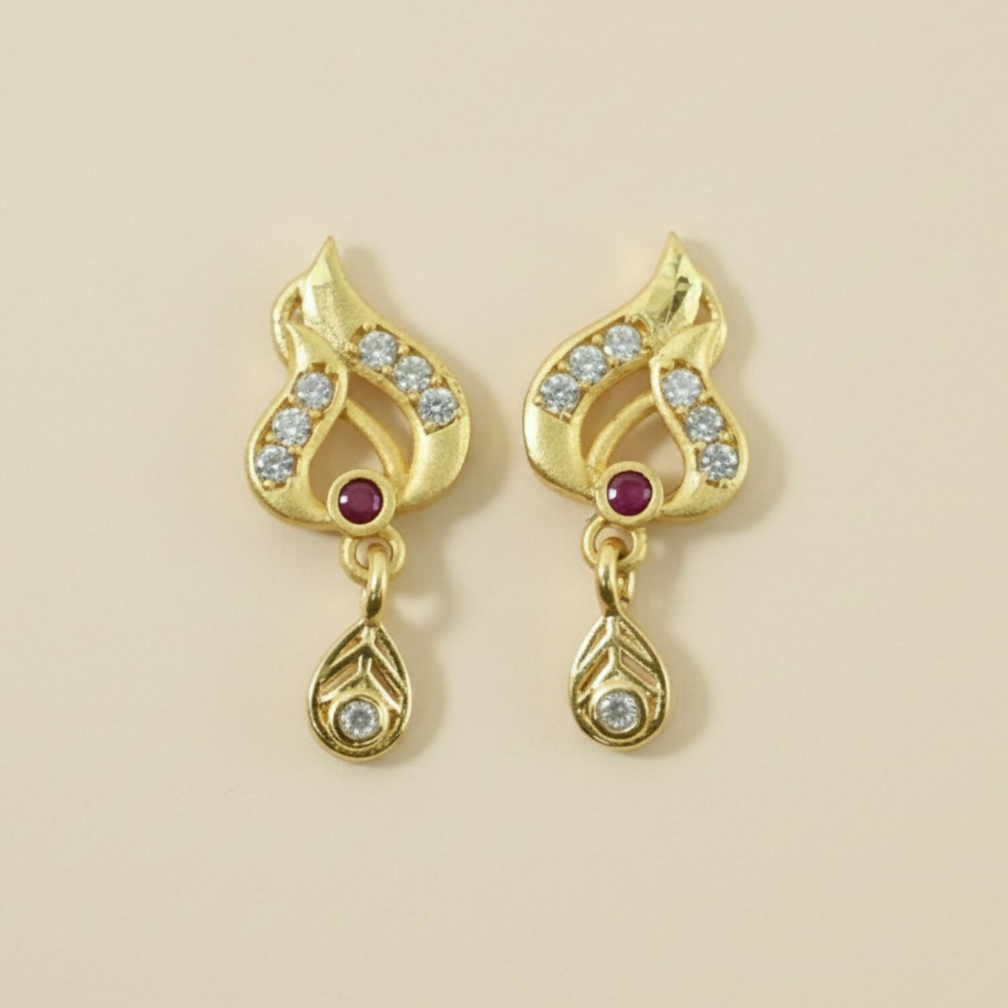 Classic Gold Tone Designer Leaf Earrings With Ruby Accent And Graceful Hanging Drop