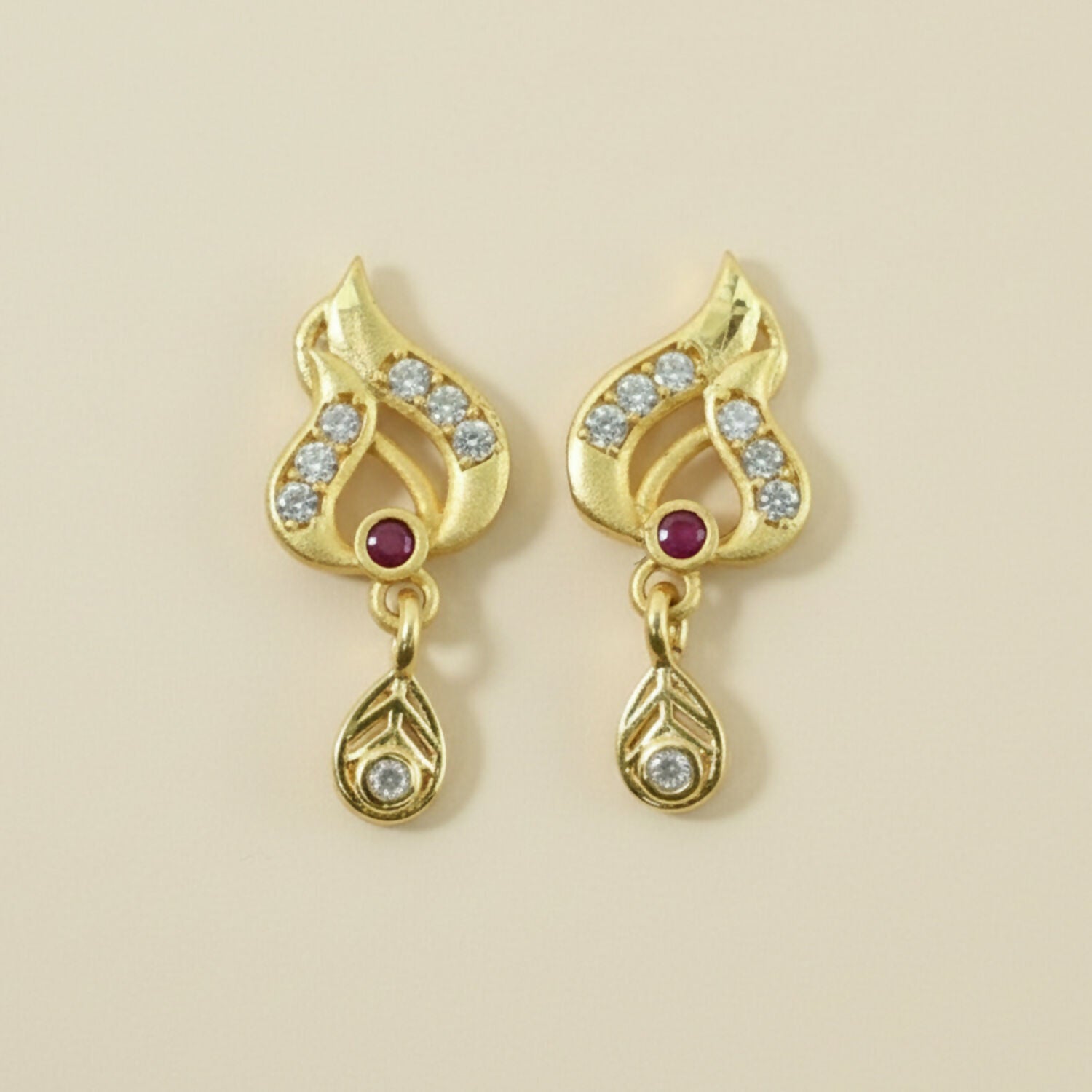 Classic Gold Tone Designer Leaf Earrings With Ruby Accent And Graceful Hanging Drop