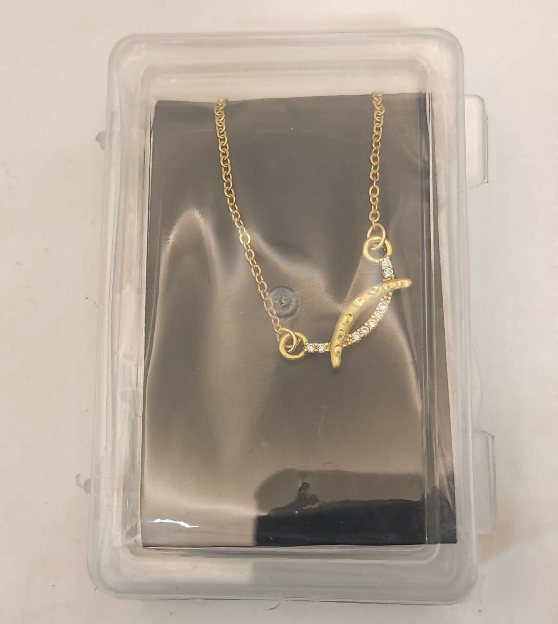 Gold plated AD necklace shown with lobster clasp and intricate cubic zirconia design