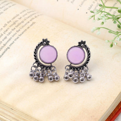 Close-up of vintage-style frame and lavender stone earrings