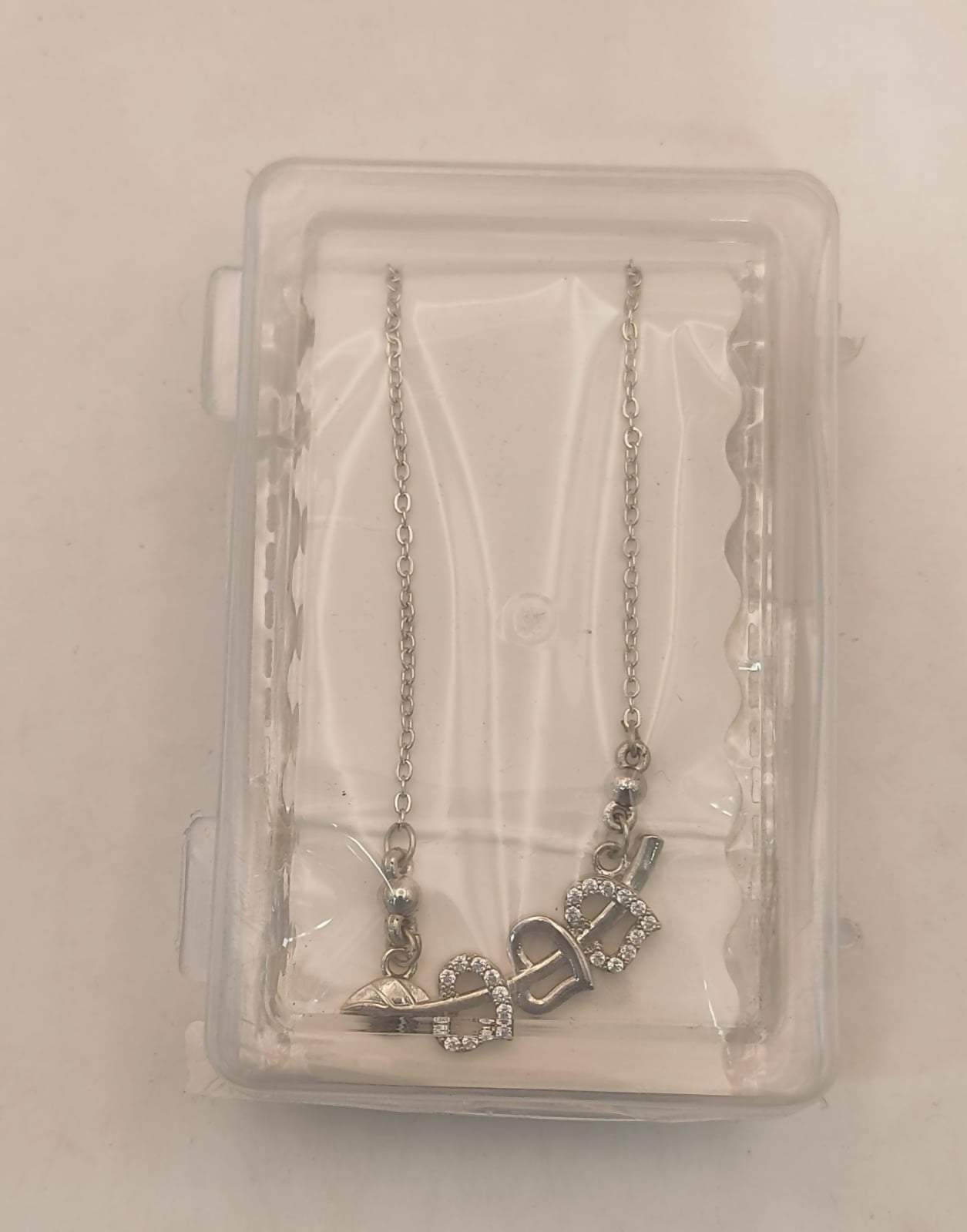 Stylish silver tone double heart pendant necklace symbolizing love and connection