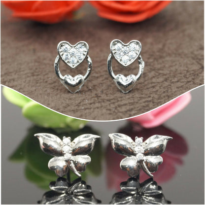 Silver heart and butterfly stud earrings set displayed on white background