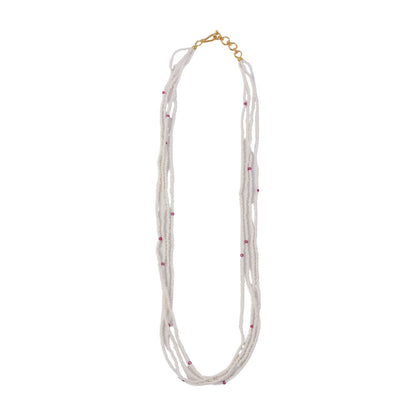 Side view of elegant pearl mala necklace with pink accents highlighting craftsmanship