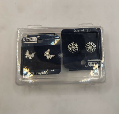 Pair of silver-plated butterfly and floral stud earrings on white background