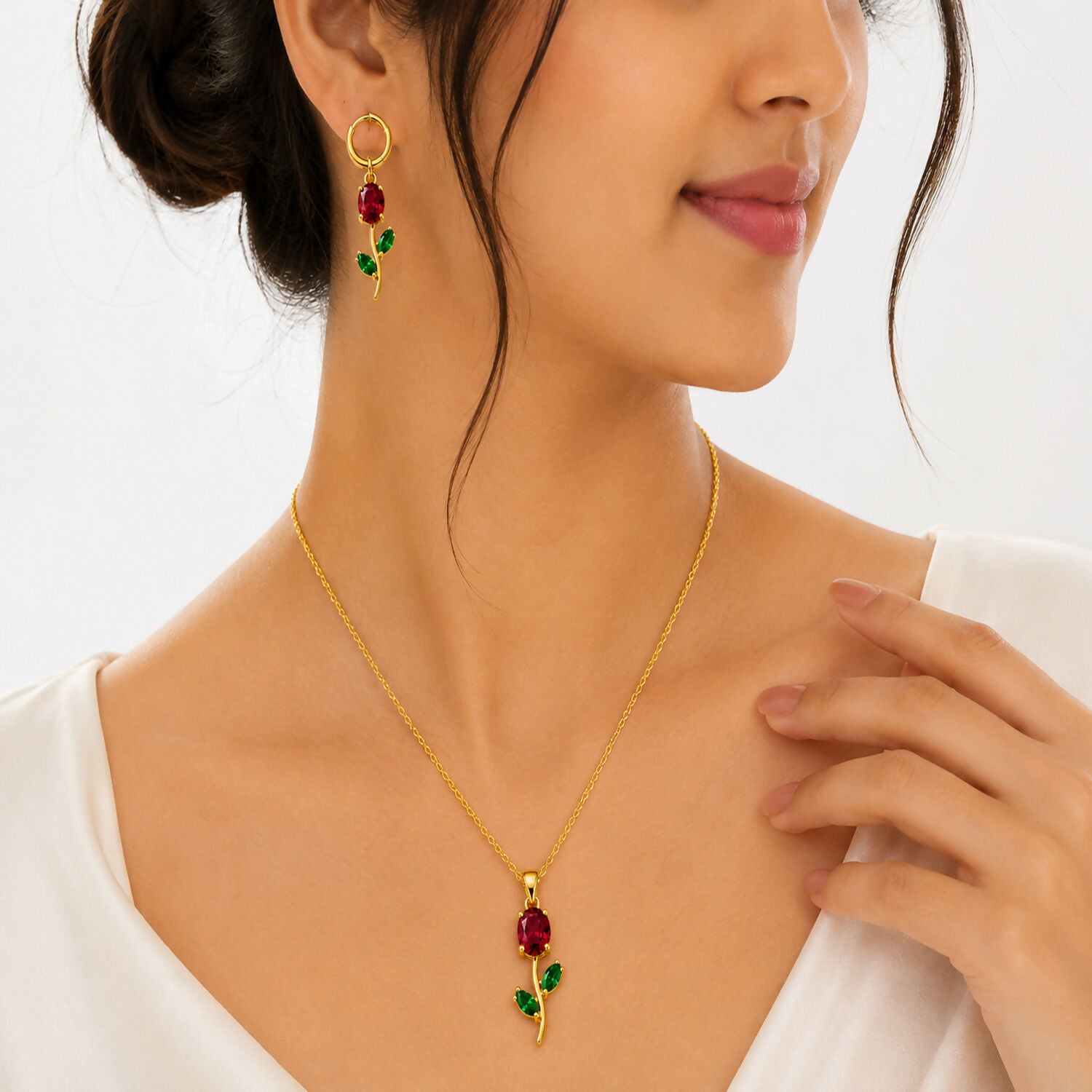 Side view of the ruby red crystal earrings from the floral pendant set.