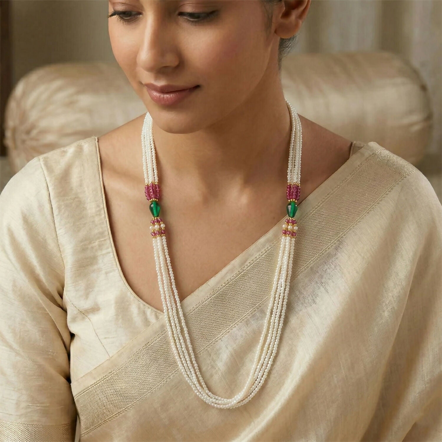 Elegant layered pearl necklace styled on a mannequin
