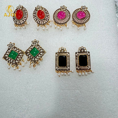 Different angle showing design details of antique stone and pearl earrings