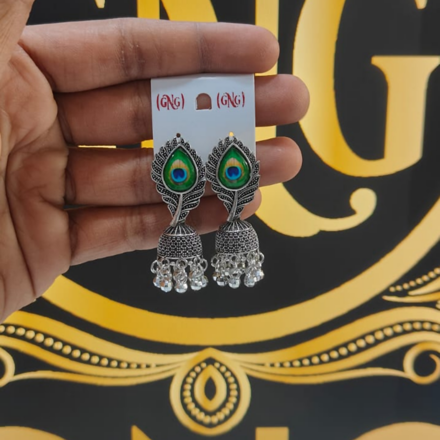 Oxidised Silver Jhumka Earrings Designed With Elegant Peacock Feather