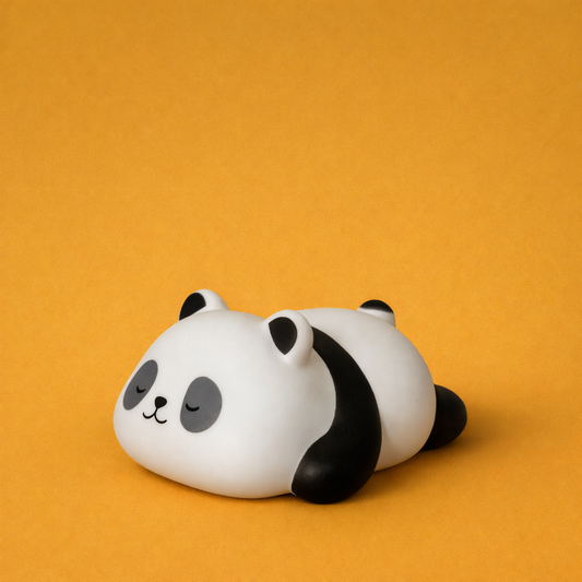 Close-up of children's LED night light featuring a sleeping panda design