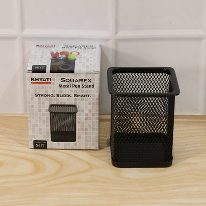 Open mesh black pen holder on study table