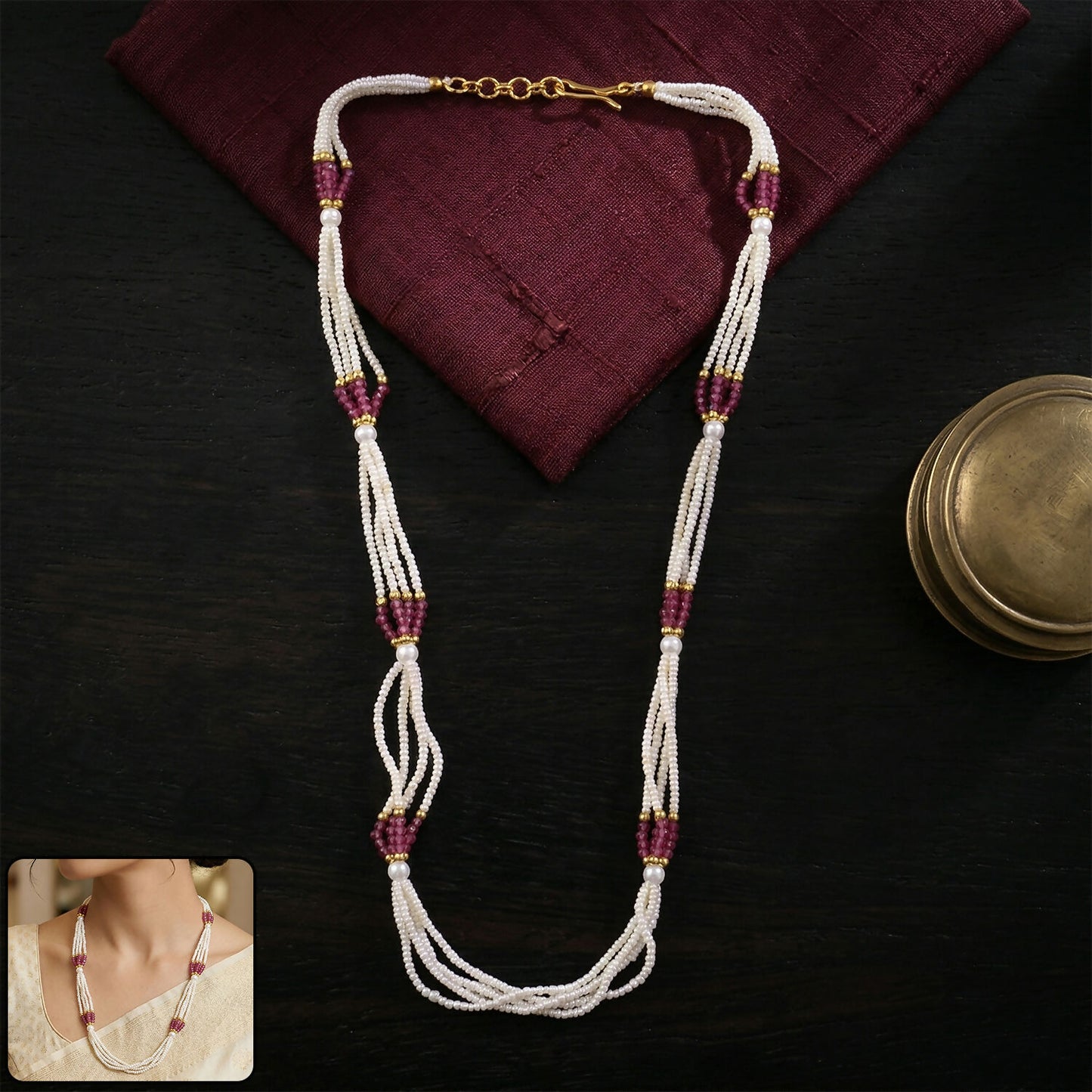 White multi-strand beaded mala necklace with pink accents