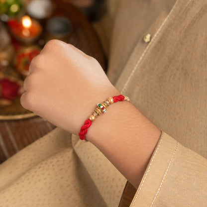 Red Twisted Cord Rakhi with a Colourful Enamel Bead and Gold Accents