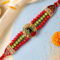 Red Green Beaded Rakhi with Gold Medallion and Bright Traditional Festive Gift Style