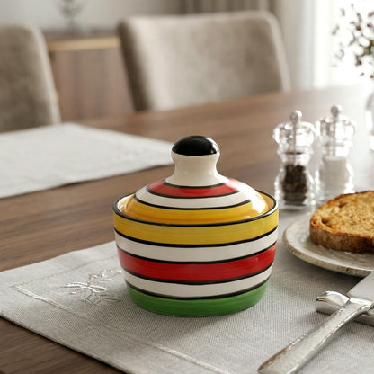 Ceramic butter pot with lid opened showing fresh butter inside