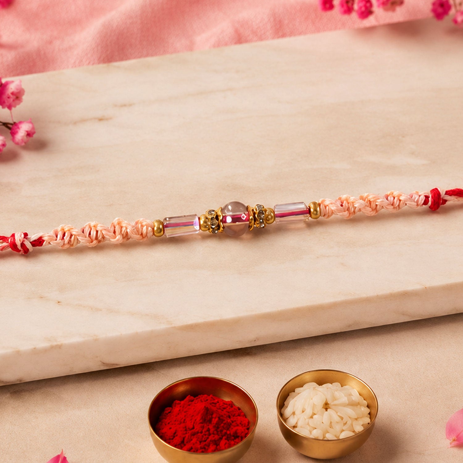 Sparkling Pearl Stone Rakhi with Colorful Thread and Premium Festive Beauty