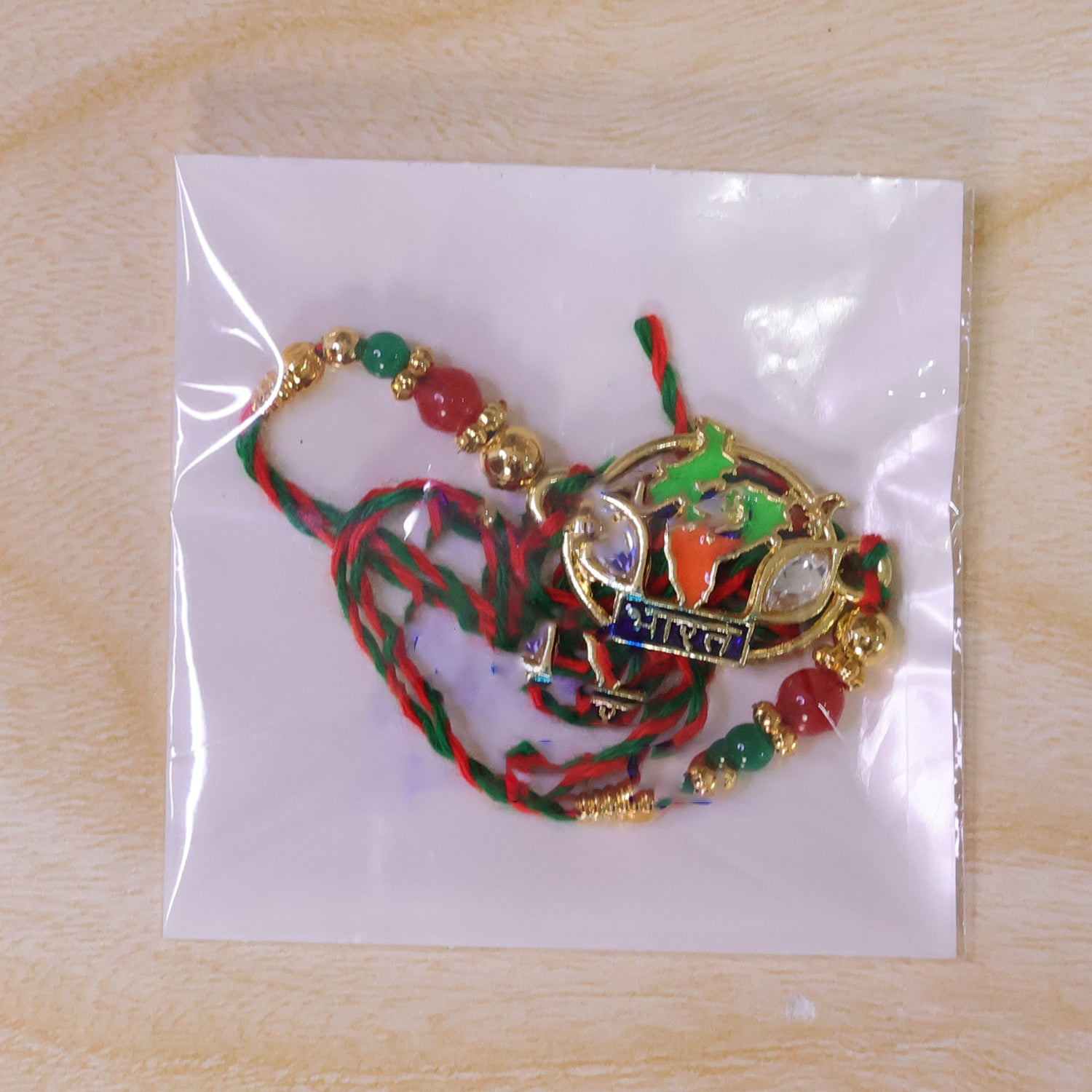 Bharat Map Pendant Rakhi with Kundan Stones and Red Beads