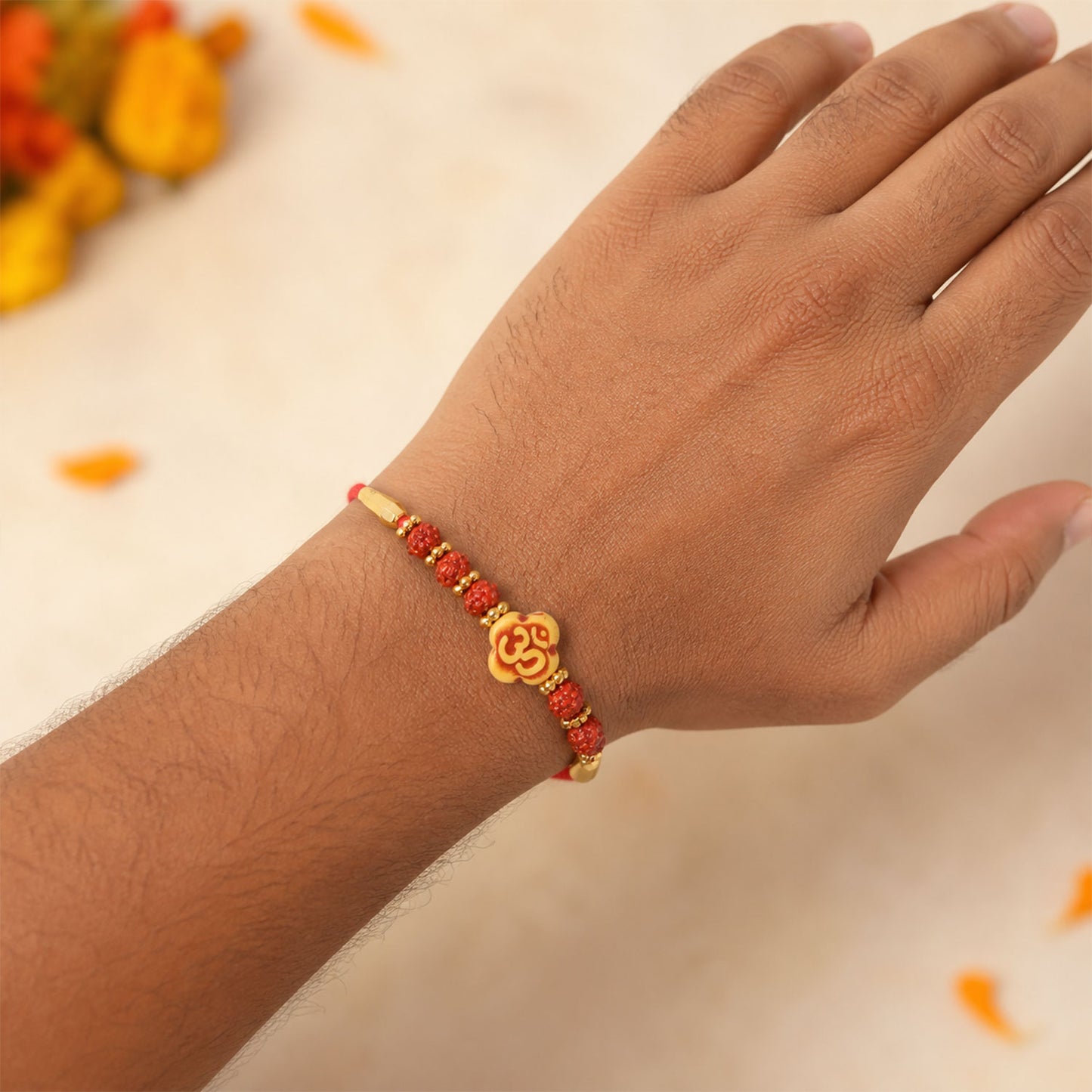 Om Bead Rakhi with Red Brown Accents and Spiritual Festive Brother Gift Styling Ideas