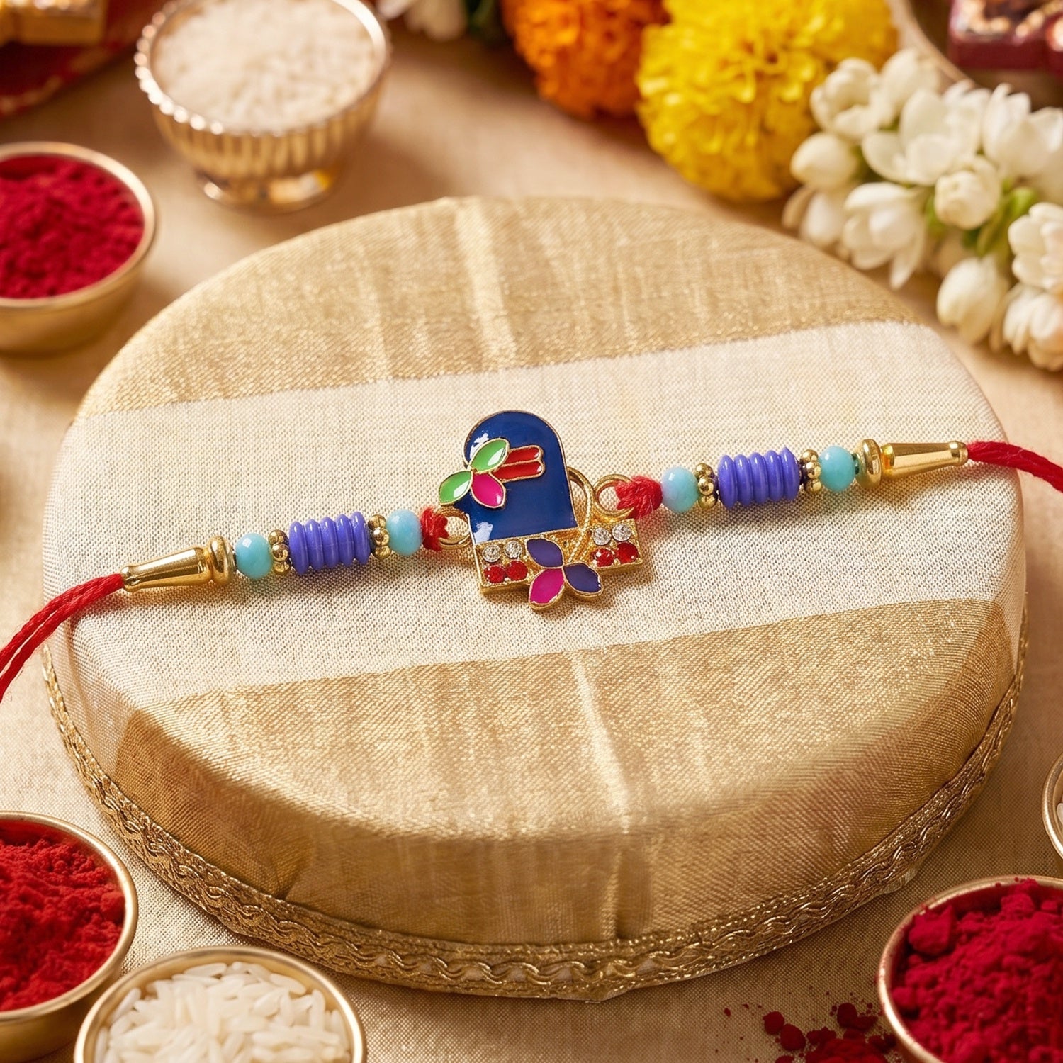 Close-up of decorative beads on Royal Blue Shiv Rakhi