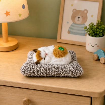 Close-up of fluffy sleeping cat plush toy with cushion