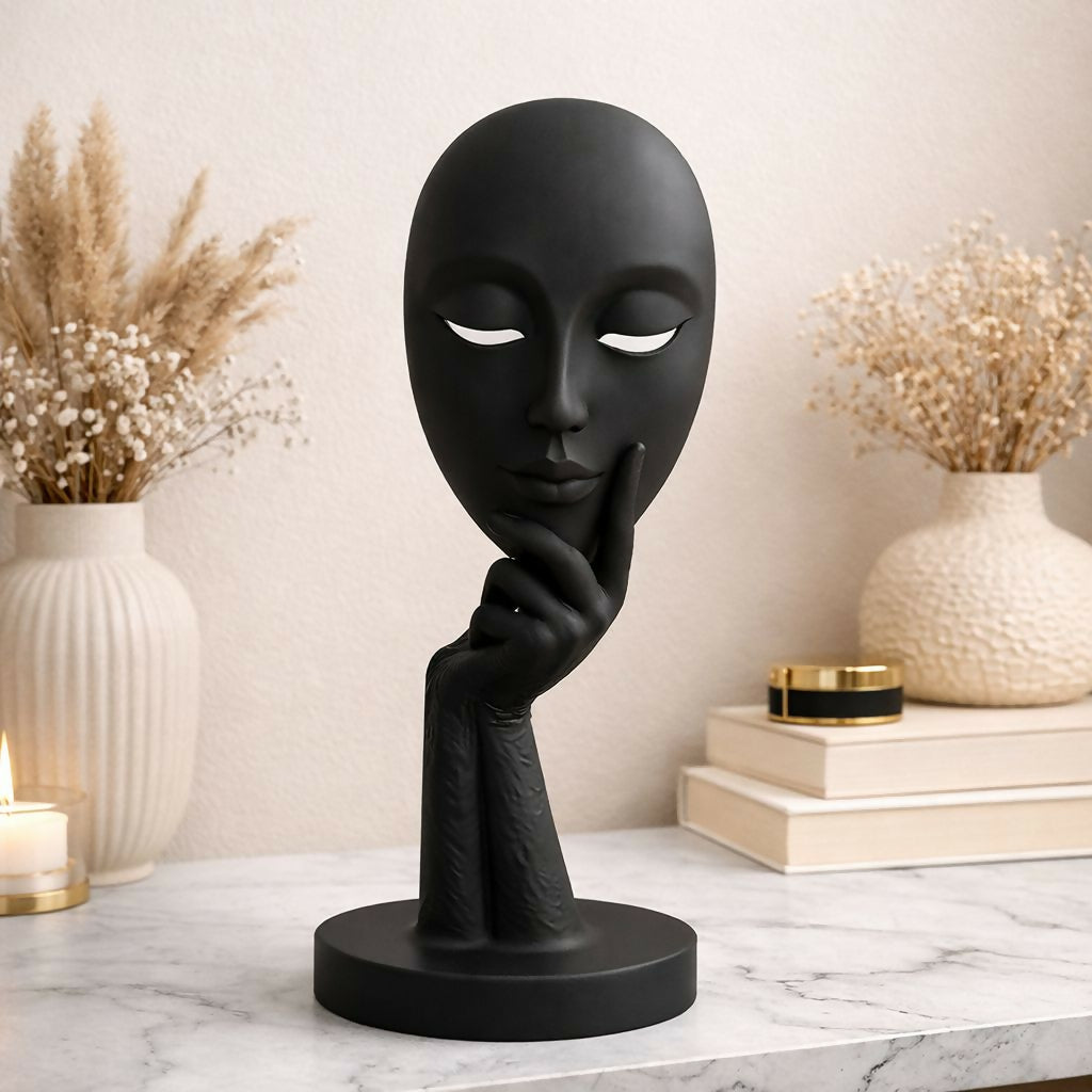 Abstract face showpiece statue with matte finish on shelf