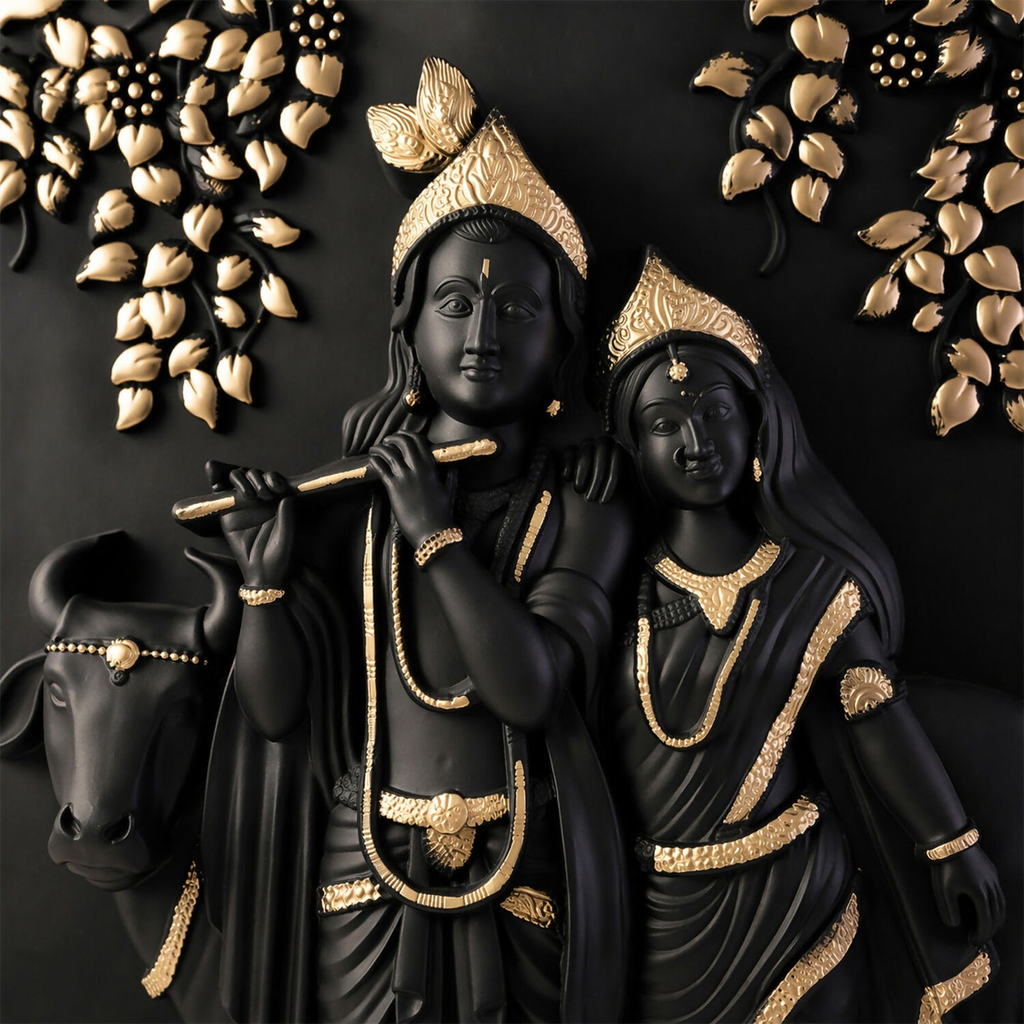 Close-up of Radha Krishna relief sculpture on wall art