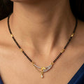 Gold and Diamond Floral Curved Mangalsutra with Single Black Bead Chain
