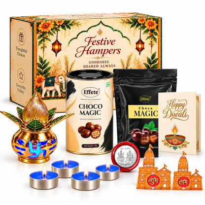 A festive hamper with a decorative box, chocolate treats, a golden kalash, tealights, and Shubh-Labh decor items.