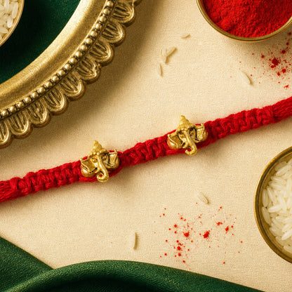 Red Thread Rakhi with Twin Antique Gold Ganesha Shaped Charms