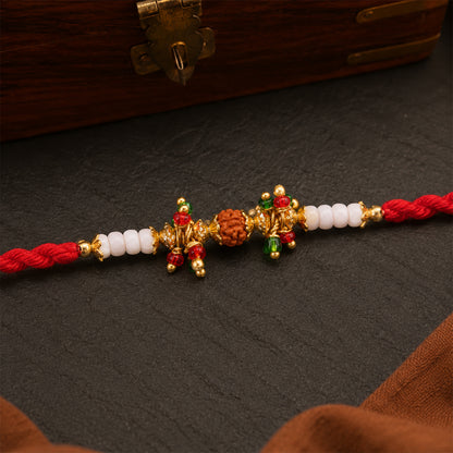 Red Pearl Designer Rakhi with Golden Accents and Compact Festive Beauty