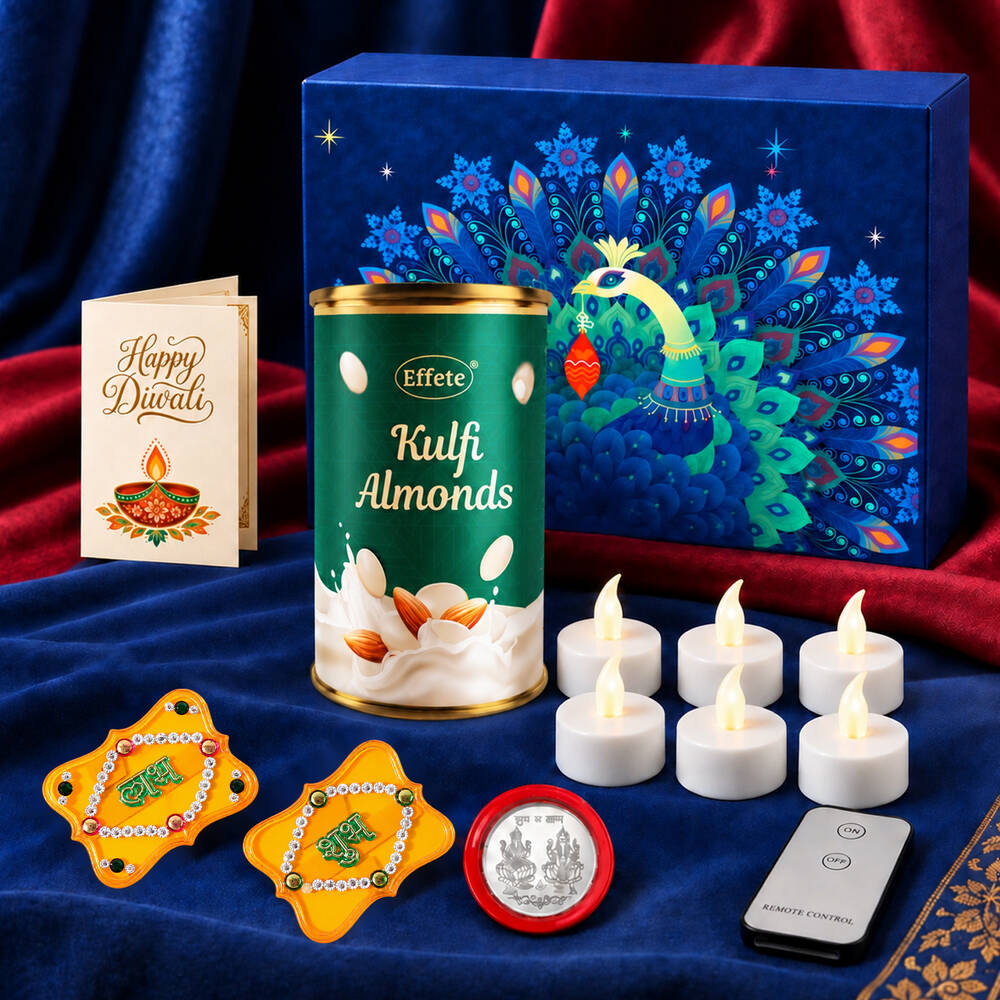 A blue gift box with a peacock design, a can of Kulfi almonds, a Diwali card, six white LED tealights, a remote, and two