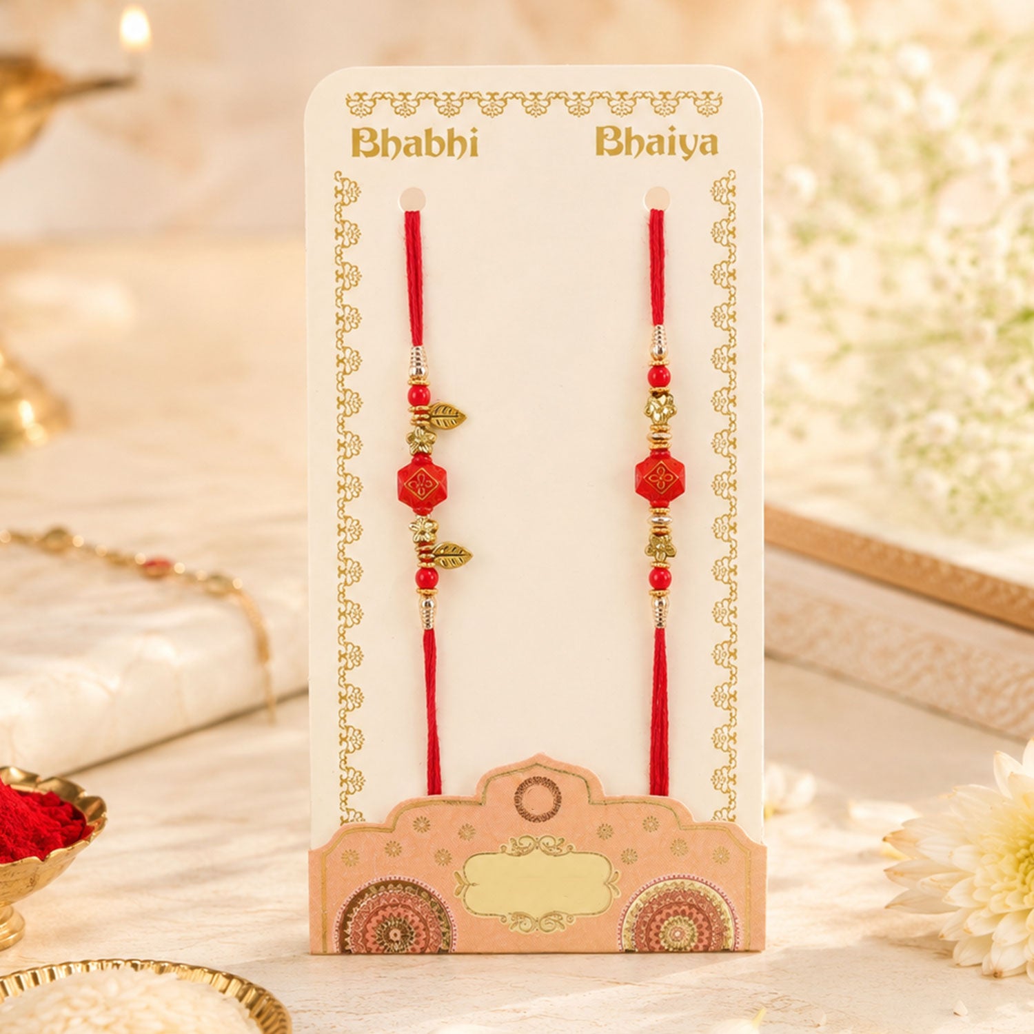 Couple Rakhi with Red Hexagon Charm, Gold Beads and Leaf Accents