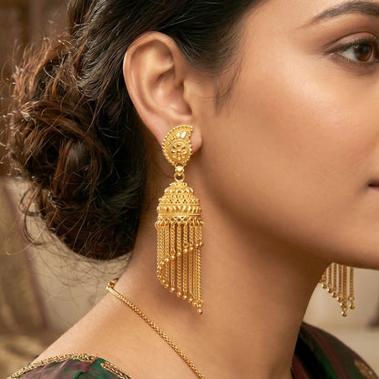 Side view of jhumka earrings showing pearl drops and chain