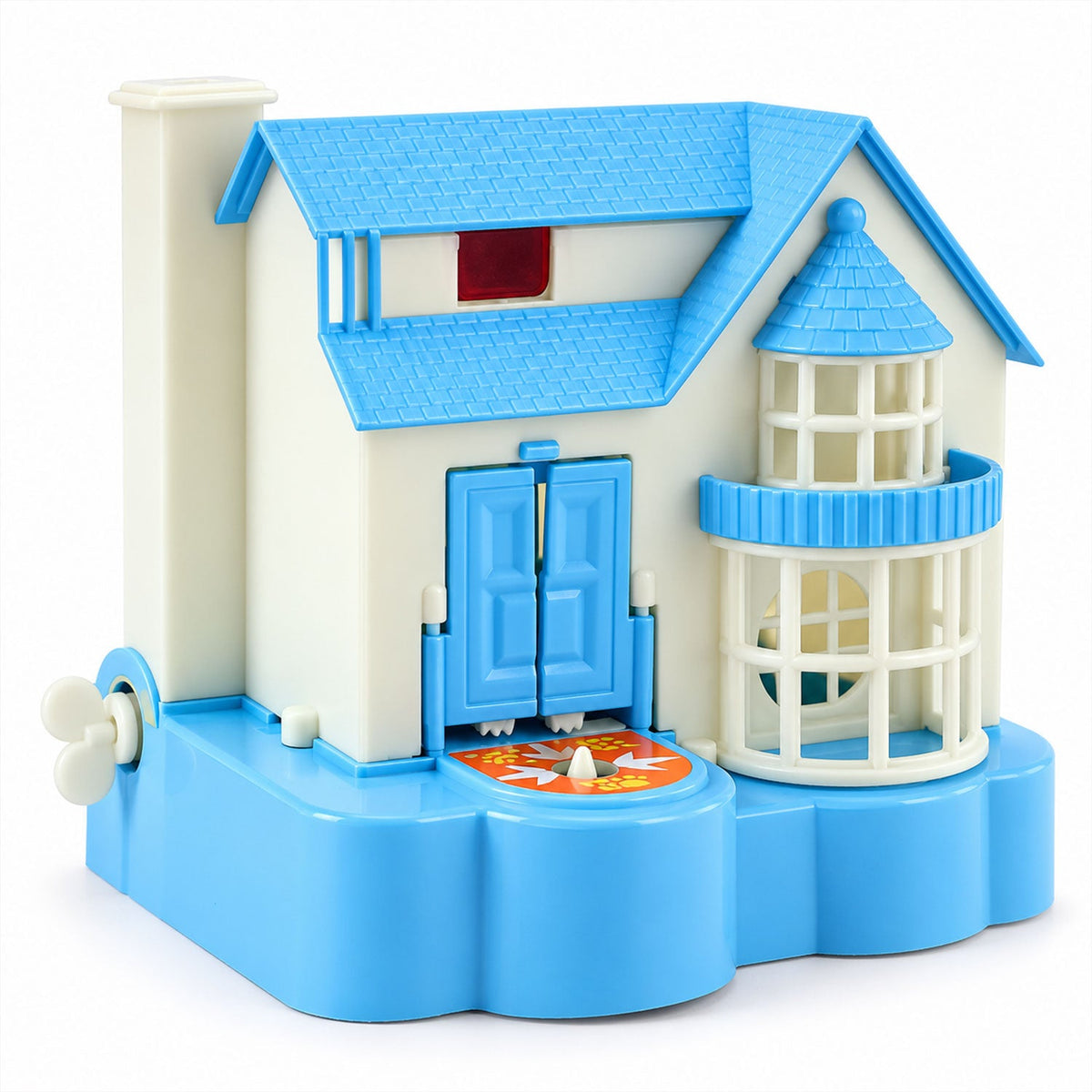 A blue and white house-shaped coin bank with a wind-up key, a red window, and a lighthouse-style tower.