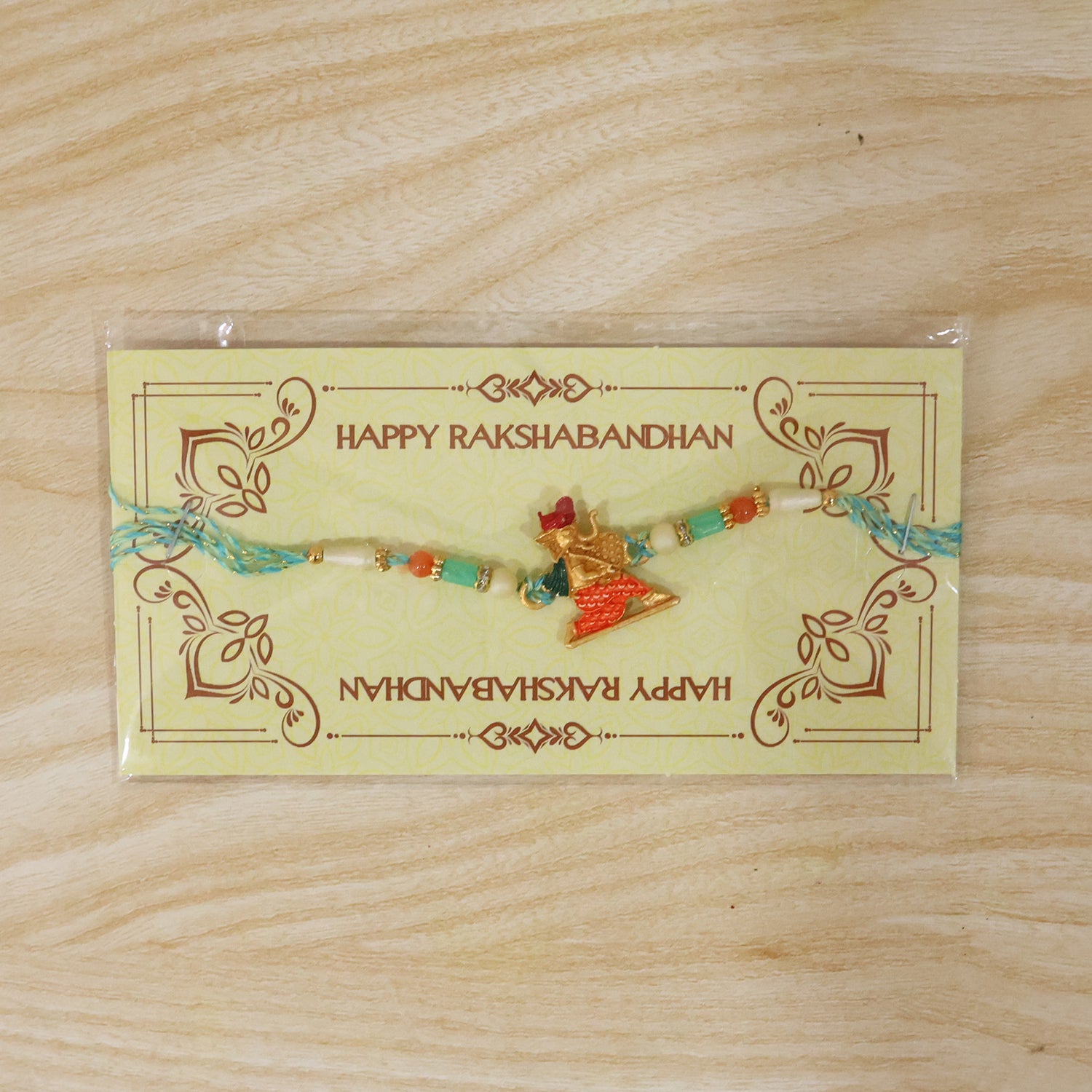 Colorful Ganesh Rakhi for Boys with Beads and Red-Blue Thread