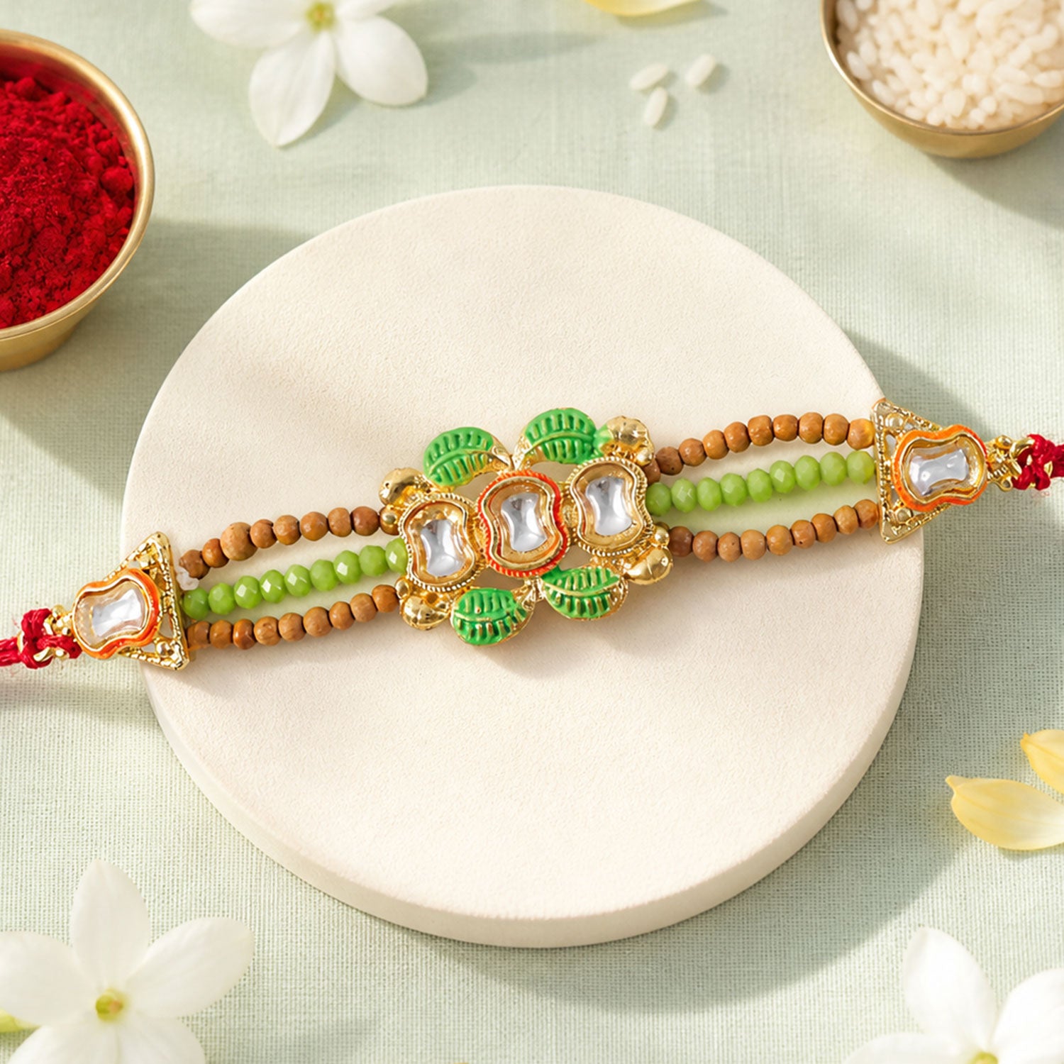 Traditional Triple Kundan & Green Leaf Motif Rakhi with Wooden & Green Beaded Strand