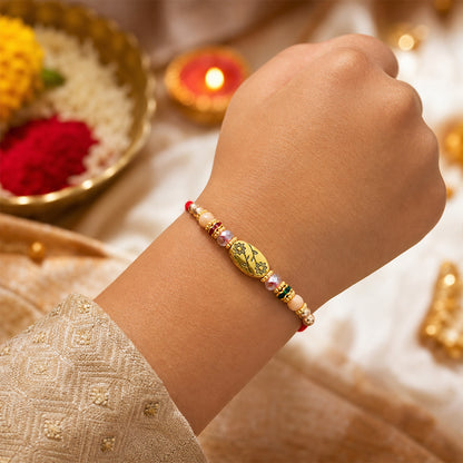 Red Thread Rakhi with Multicolour Beads and Gold Oval Floral Charm