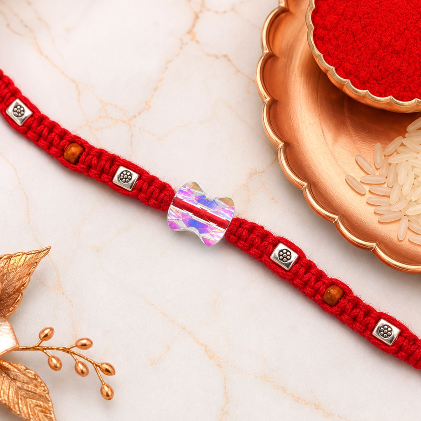 Red Braided Rakhi with an Iridescent Bow-Tie Shaped Crystal Bead