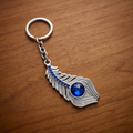 Blue Stone Peacock Feather Keychain with Silver Tone Decorative Design