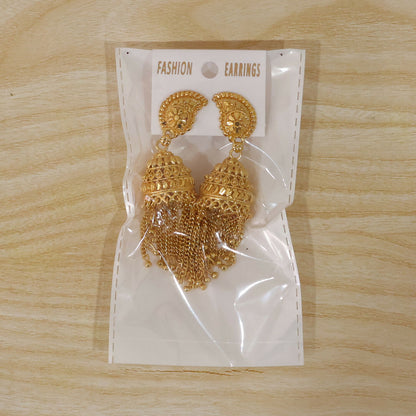 Gold-plated jhumka earrings displayed on neutral background