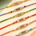Pointed Oval Motif Rakhi with Shimmering AD Stones (Pack of 6)