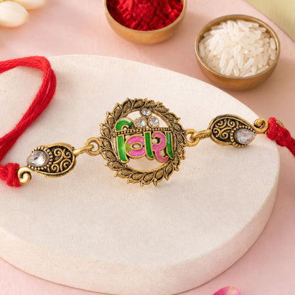 Antique Gold-Toned Veera Rakhi with Pink-Green Enamel, Crystal Accents & Red Thread