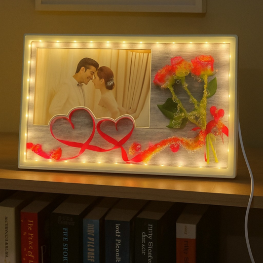 Romantic LED Photo Frame with Decorative Flowers & Heart Ribbon Design | Warm Light Illuminated Couple Picture Frame for Anniversary, Wedding & Valentine Gift | USB Powered Tabletop Love Frame for Home & Bedroom Decor
